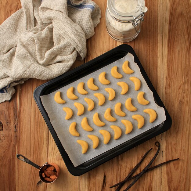 Raw Vanillekipferl, Austrian Pastry Made for Christmas, with Vanilla Pods and Powdered Sugar, Before Baked