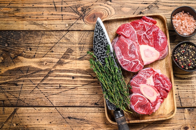 Raw veal cross cut shank meat osso buco, cooking italian ossobuco