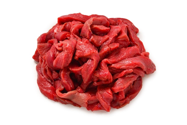 Raw veal pieces background Beef stroganoff