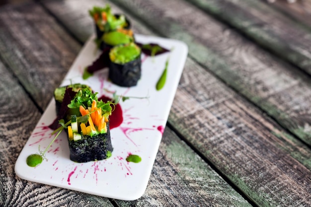 Raw vegan sushi rolls with vegetables