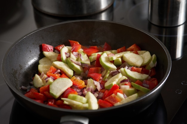 Raw vegetables cooked on a pan