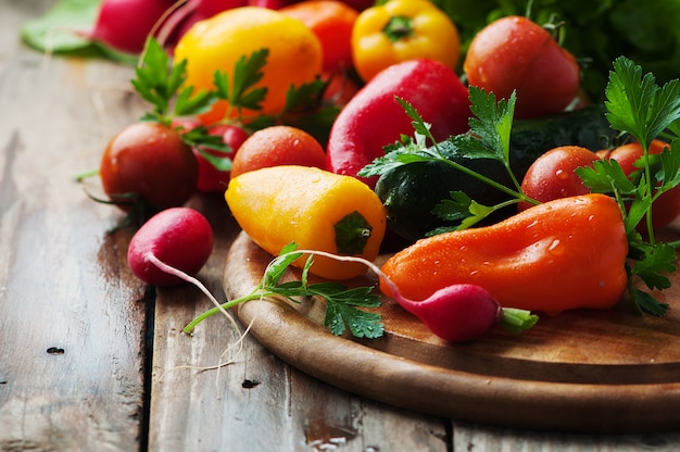 Raw vegetables on wooden table