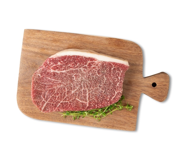 Raw wagyu shoulder roast meat over wooden board isolated over white background