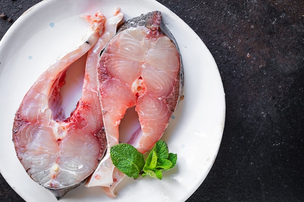 Raw white fish steak silver carp seafood healthy food diet pescetarian