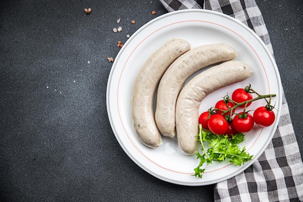 Raw white sausage weisswurst veal pork lard spices natural meal food snack on the table