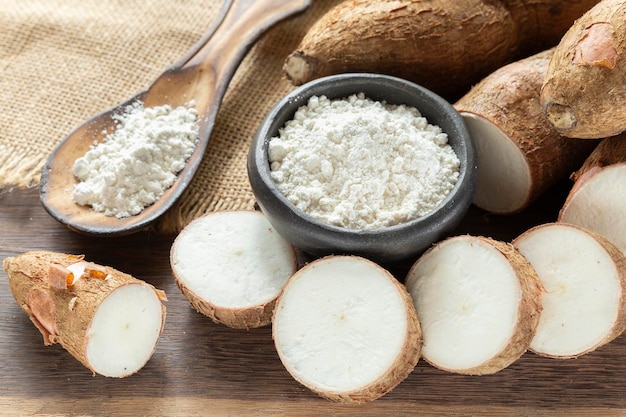 Raw yucca starch on the wooden table Manihot esculenta