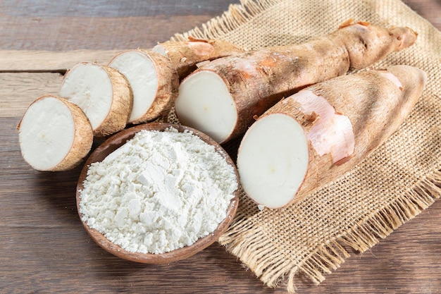 Raw yucca starch on the wooden table Manihot esculenta