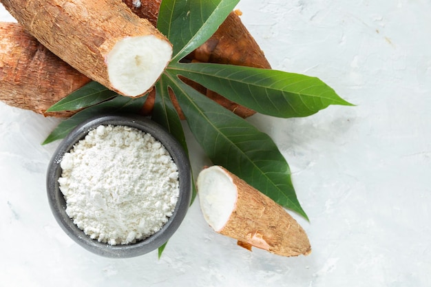 Raw yucca starch on the wooden table Manihot esculenta