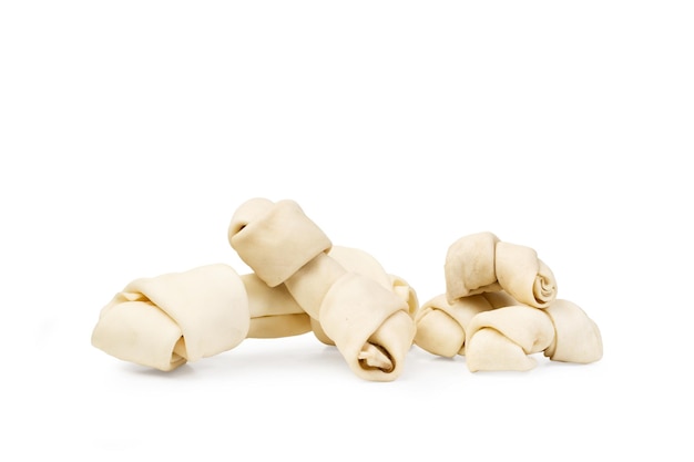 Rawhide bones on a white background with copy space