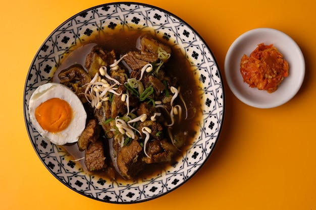 Rawon is an Indonesian beef soup. Originating from East Java, rawon utilizes the black keluak nut.