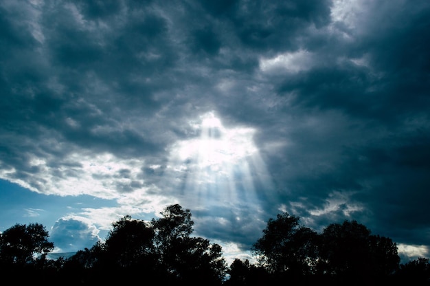 The rays of the sun pass through thunderclouds