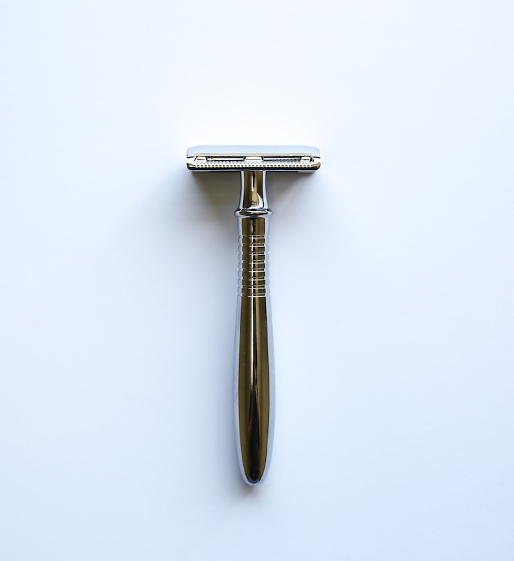 Photo razor on the table. stylish men idea for a gift. barber shop things.