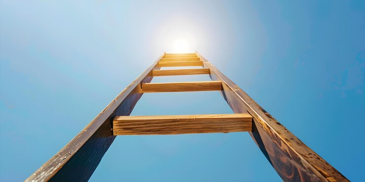 Photo reaching for the sky a tall ladder concept sky reaching tall ladder
