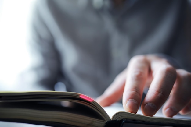 Read book A man sits and reads literature Textbooks to study Religion