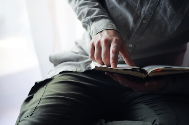 Read book A man sits and reads literature Textbooks to study Religion