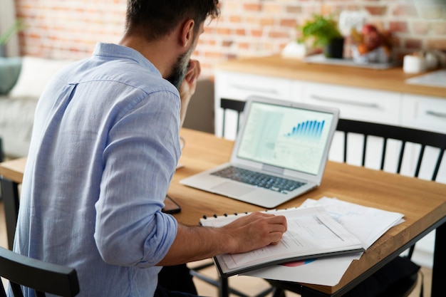 Read view of man working at home