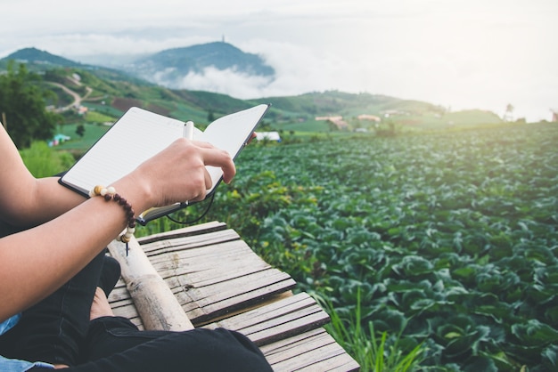 Read women relax in the park. Morning atmosphere The mountains are foggy. phetchabun phutubberg thai