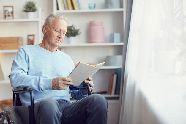 Reading book in wheelchair