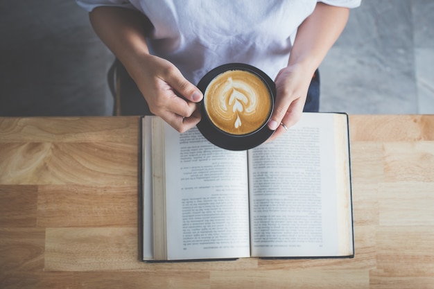 reading book with coffee