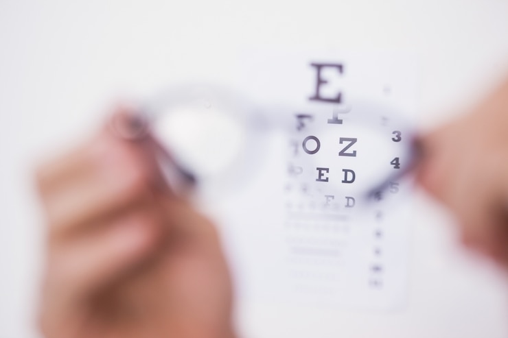 Photo reading glasses looking at eye test
