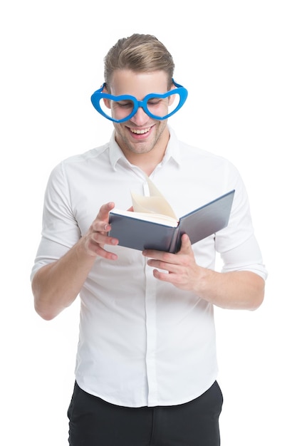 Reading is fun Happy man read book isolated on white Funny guy enjoy reading in fancy glasses Bibliophile Reading story Using imagination School and education Reading makes you more creative