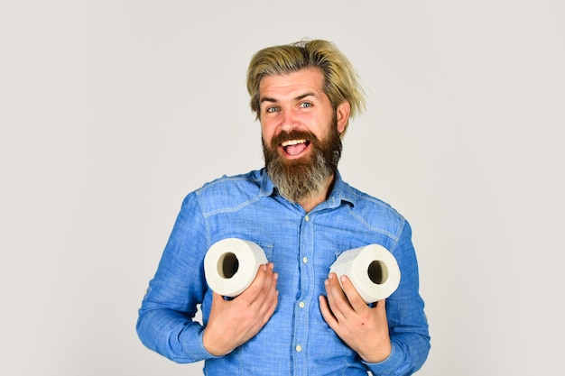 Photo ready for any event toilet paper shortage in coronavirus panic fear of pandemic outbreak closing shopping stores man hold tissue in toilet bearded man hold toilet paper guy suffer from diarrhea