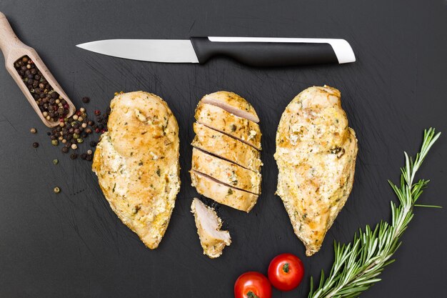 Ready chicken on the old plastic cutting board.