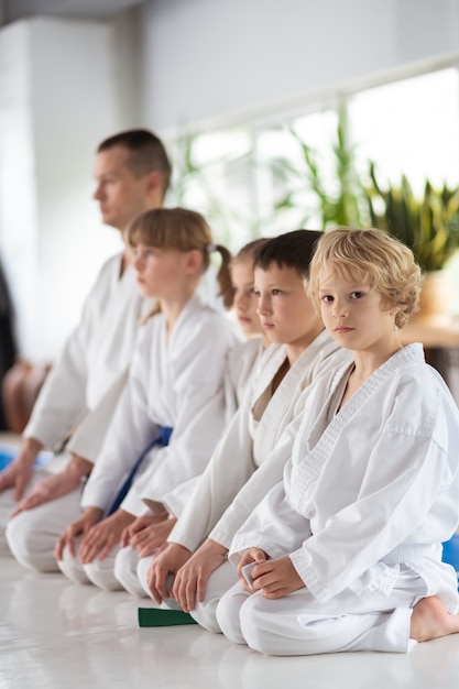 ready for competition. children in white kimono feeling ready for important aikido competition