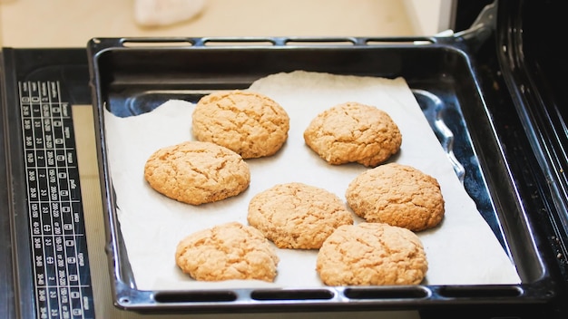 Ready fresh homemade cookies in the oven close up