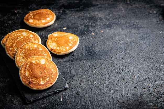 Ready made homemade pancakes on a stone board