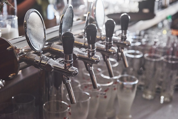 Ready to pint of beer on a bar in a traditional style wooden pub