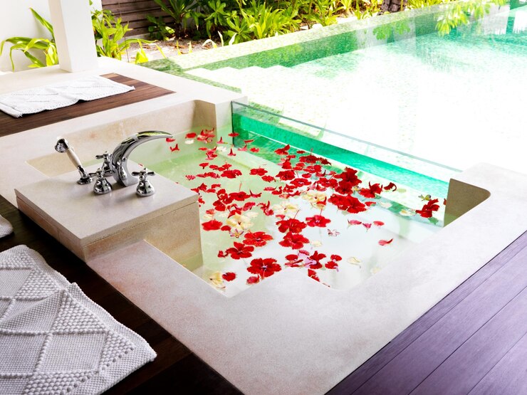 Photo ready for relaxation modern bathroom with bath tub full of flower petals at a spa resort