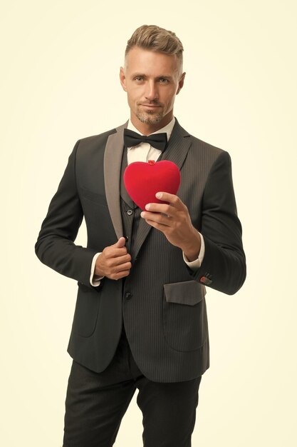 ready for romantic date special occasion evening elegant confident man isolated on white businessman formal outfit love symbol on valentines day tuxedo man red valentines heart