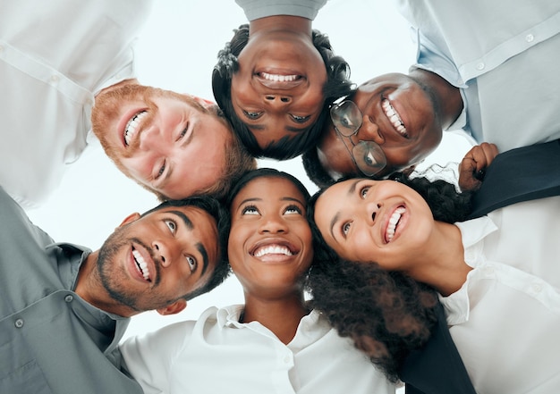 Ready team Low angle shot of a diverse group of young businesspeople standing in a huddle in the office