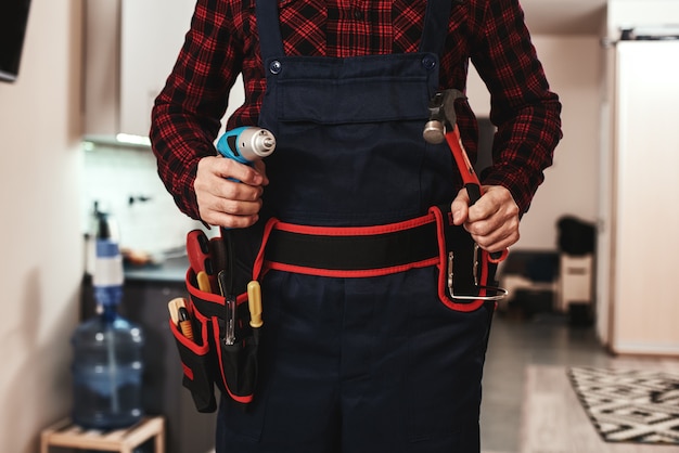 Photo ready to work cropped photo of repairers hands with special equipment