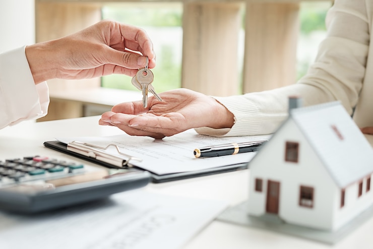 Photo real estate agent and customer signing contract to buy house, insurance or loan real estate.