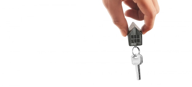 Real estate agent handing over house keys in hand