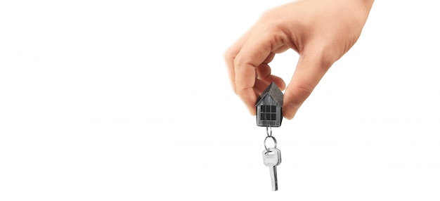 Real estate agent handing over house keys in hand