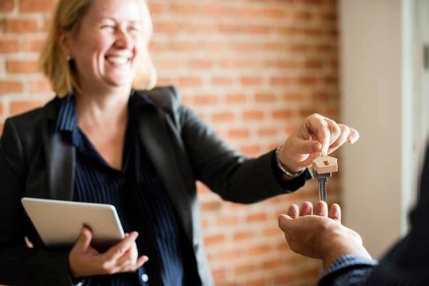 Real estate agent handing over the keys