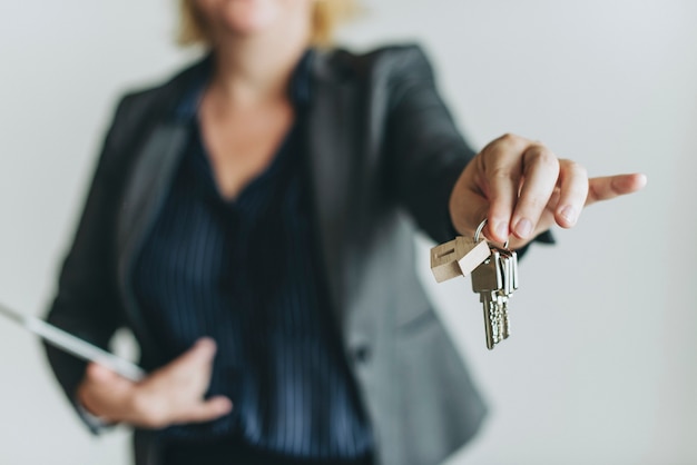 Real estate agent handing over the keys