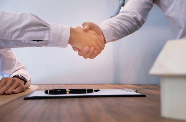 Real estate agent handshake. Business partnership meeting concept