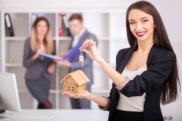 Real estate agent portrait with family getting new home