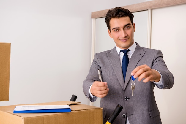 Real estate agent with key from new house