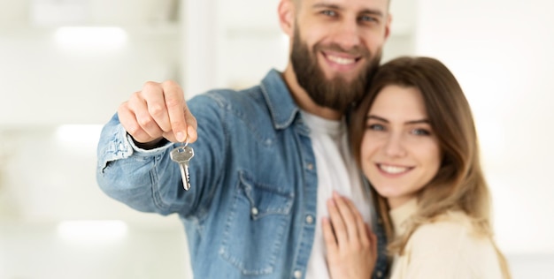 Real Estate Concept Couple Holding New House Keys