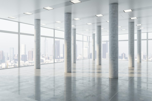 Real estate concept with perspective view on spacious sunlit
hall on high floor with huge concrete columns on light grey floor
and city skyscrapers view from panoramic windows 3d rendering