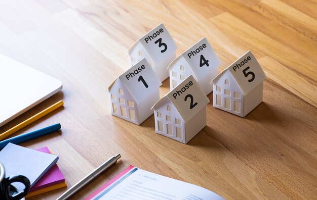 Real estate and developer or investment concepts with home model on desk table.no people