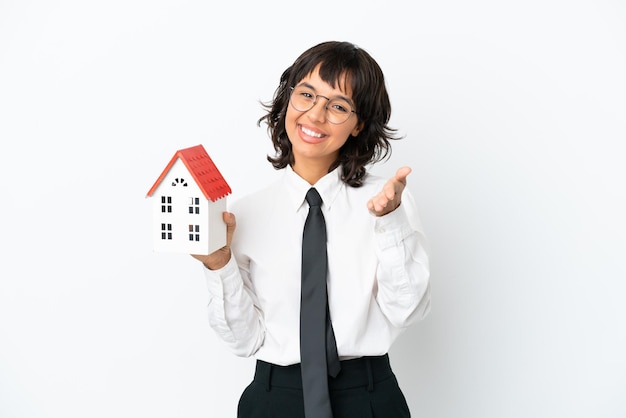 Real estate mixed race agent isolated on white background shaking hands for closing a good deal