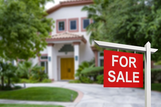 Real estate sign in front of new house for sale