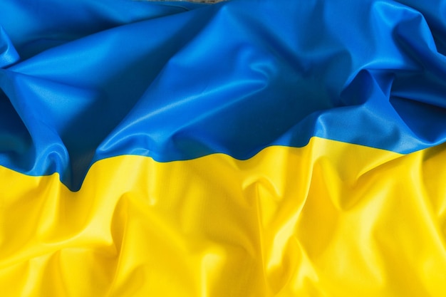 Real fabric waving flag of Ukraine National yellow and blue Ukrainian flag for Independence day