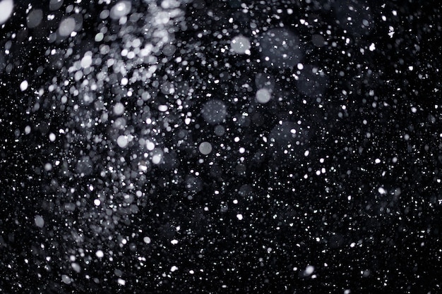 Real falling snow on black background for blending modes in ps. Ver 07 - many snowflakes in blur.